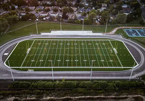 An aerial view of a whole football field is shown.
